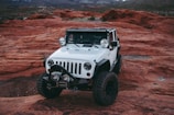 white Jeep Wrangler on land