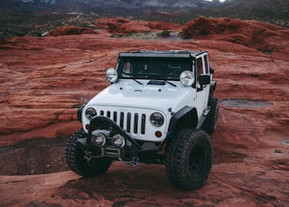 white Jeep Wrangler on land