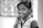 grayscale photography of smiling girl