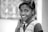 grayscale photography of smiling girl