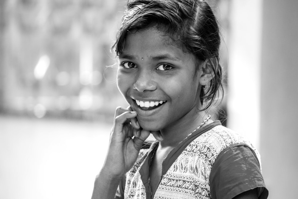 grayscale photography of smiling girl