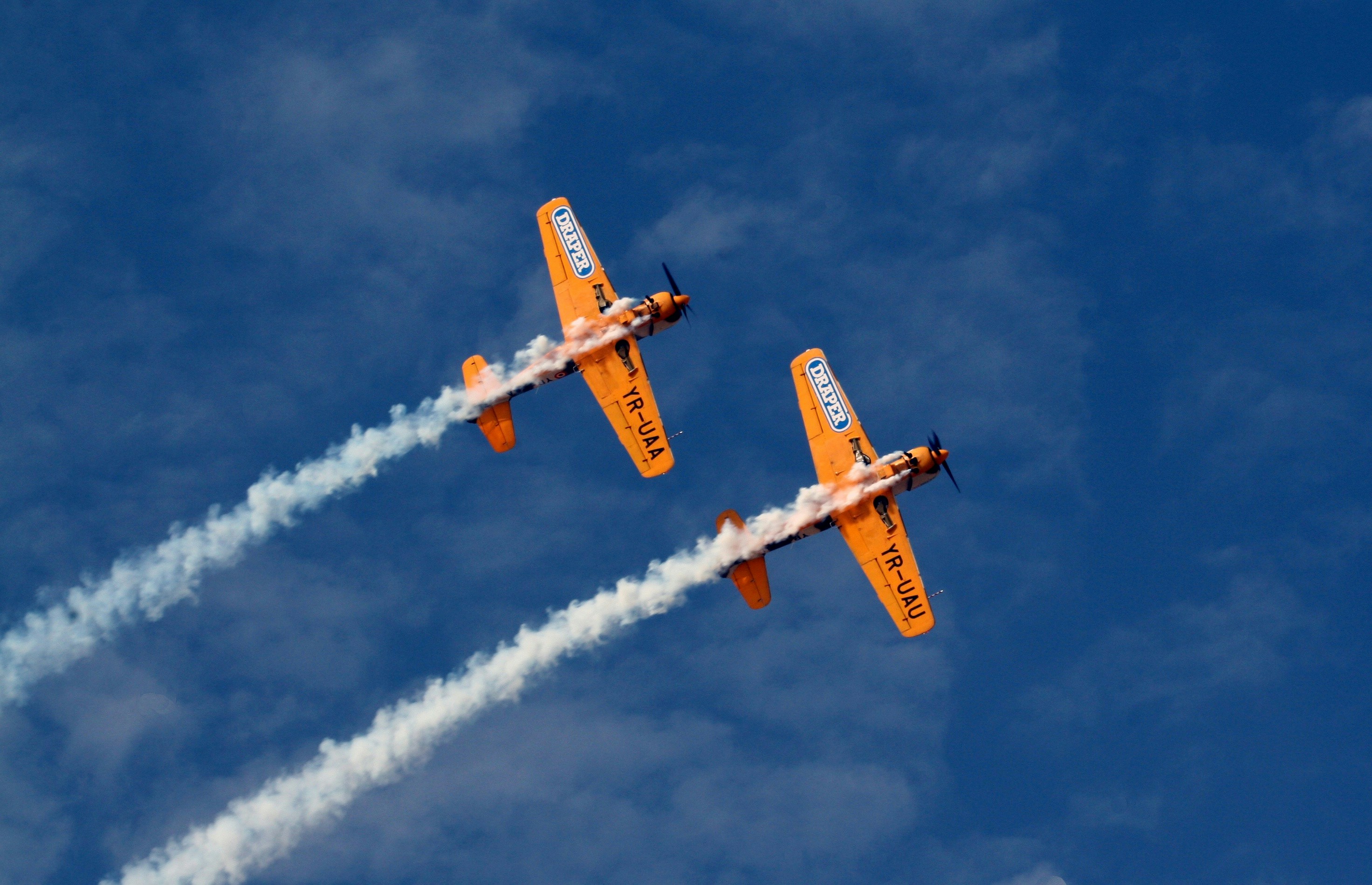 two orange jet planes, Two aircraft in formation