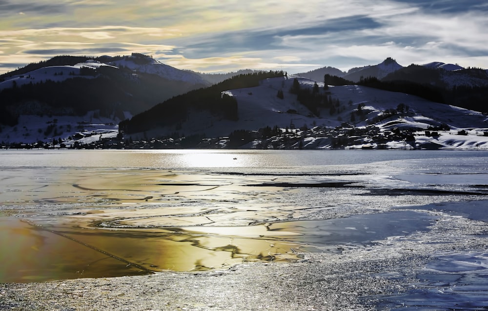 iced lake under clouded sky