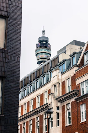 A dynamic collage showing telecommunications towers, fiber optic cables, construction sites, and modern real estate developments.