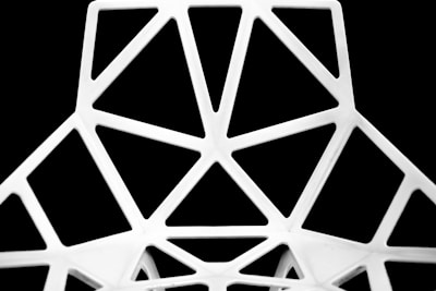 Close-up of a scientific art print with sharp geometric lines on a black background