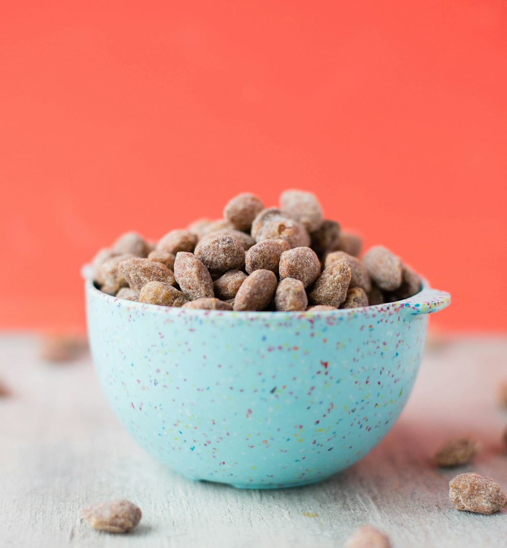 brown beans in blue ceramic bowl