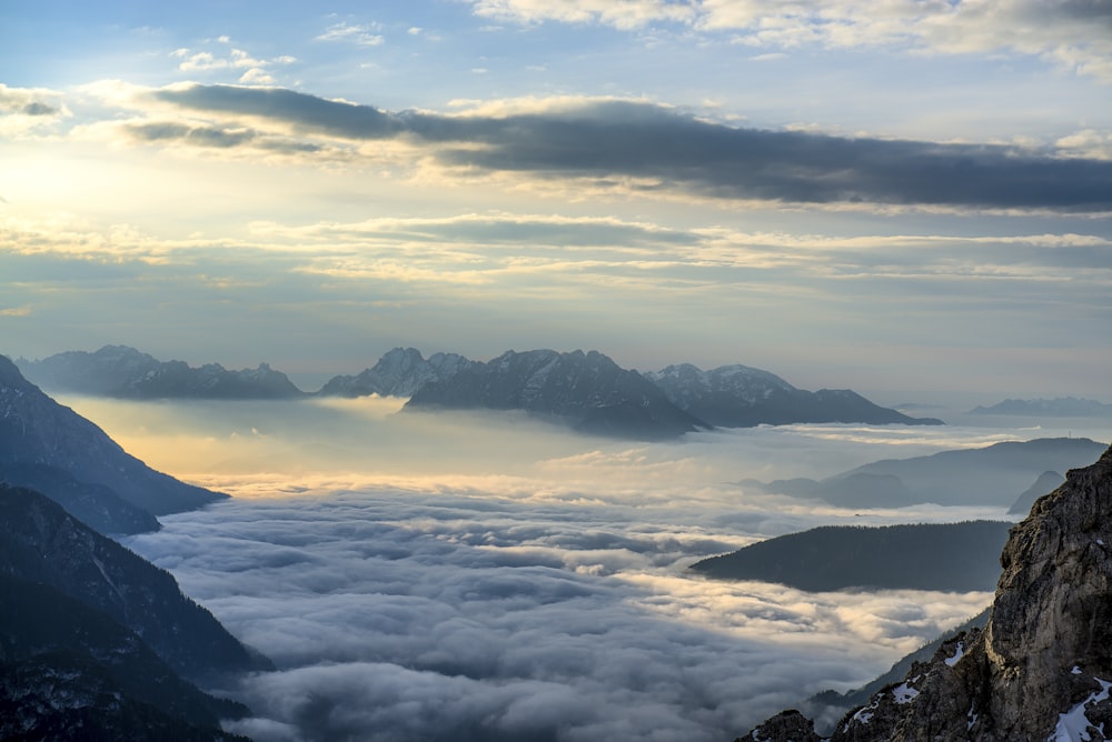 landscape photography of mountains surrounded with clouds