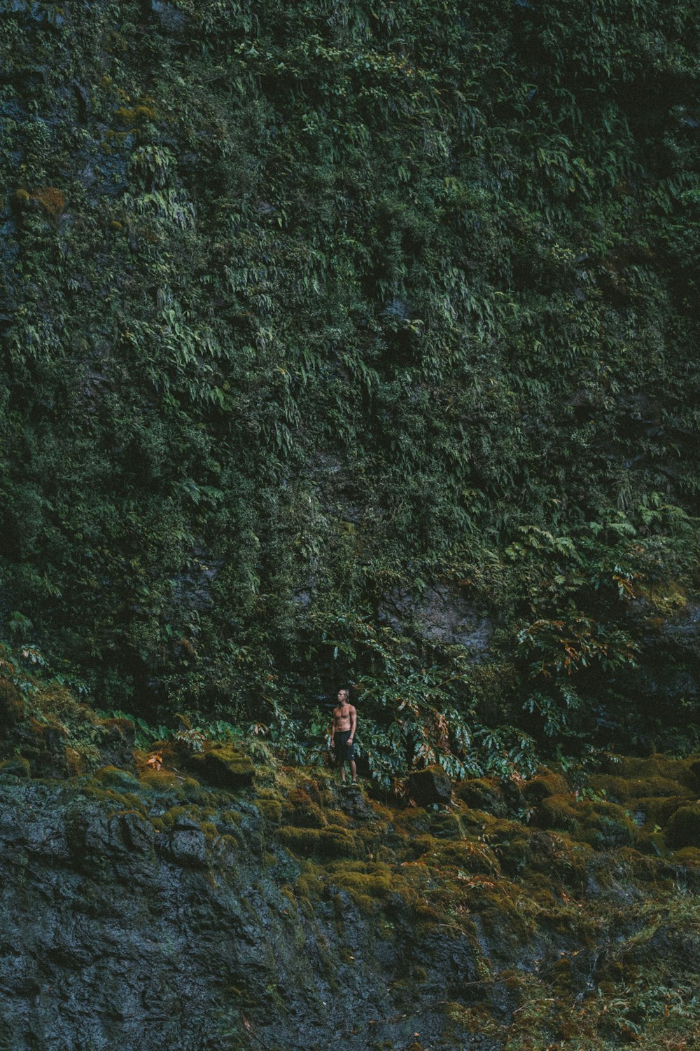 man standing beside mountain