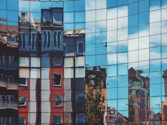 buildings reflection on glass building in Cologne Germany