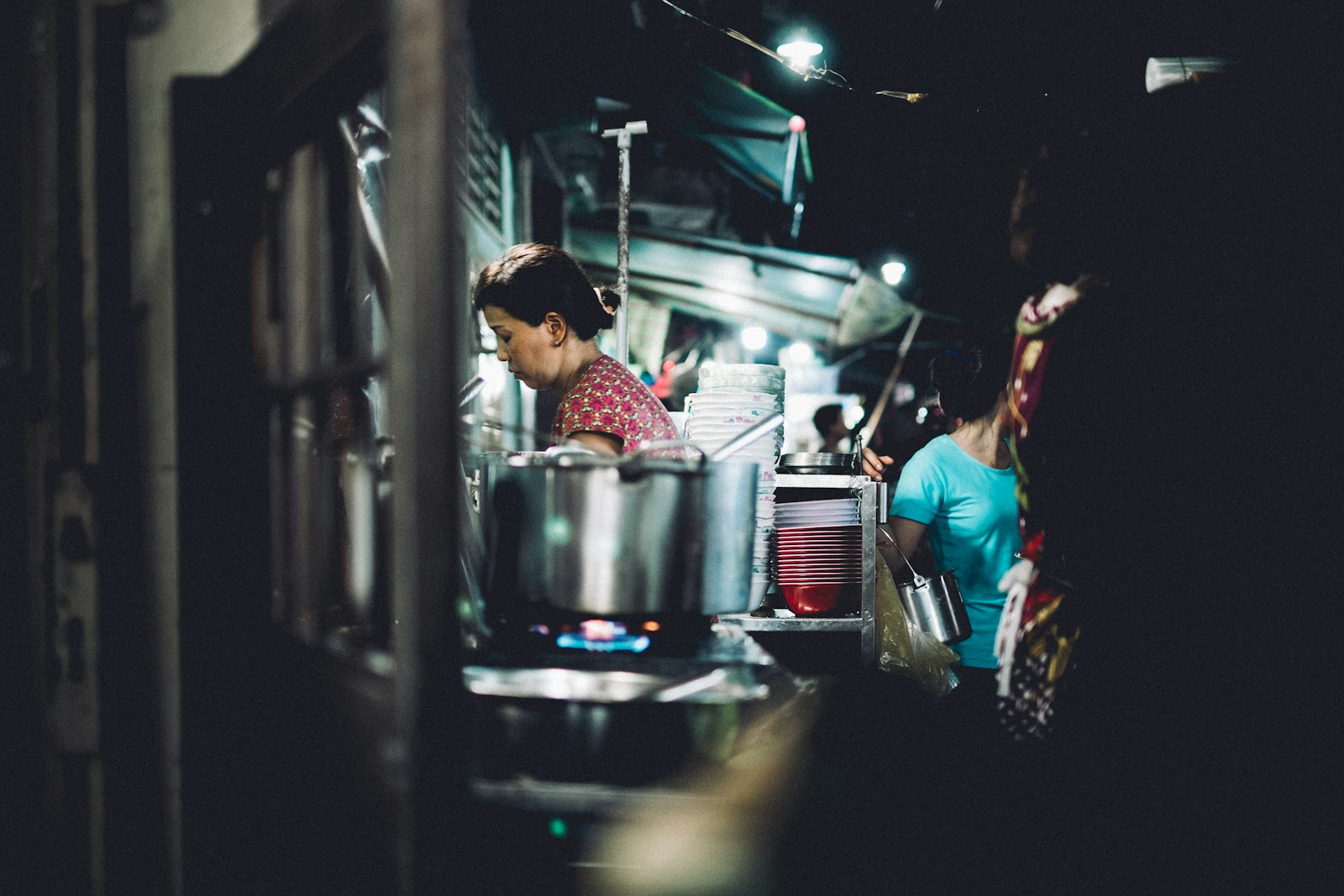 Fujifilm X-Pro1 sample photo. People passing by cooking photography