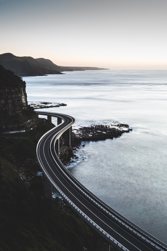 bird's eye view of curved road in Sea Cliff Bridge Australia