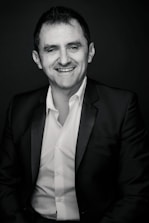 A smiling candidate receiving interview coaching in a professional setting.