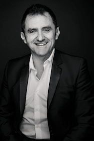 A smiling candidate receiving interview coaching in a professional setting.