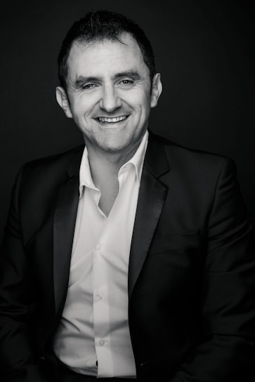 Portrait of the general manager smiling warmly in an office setting