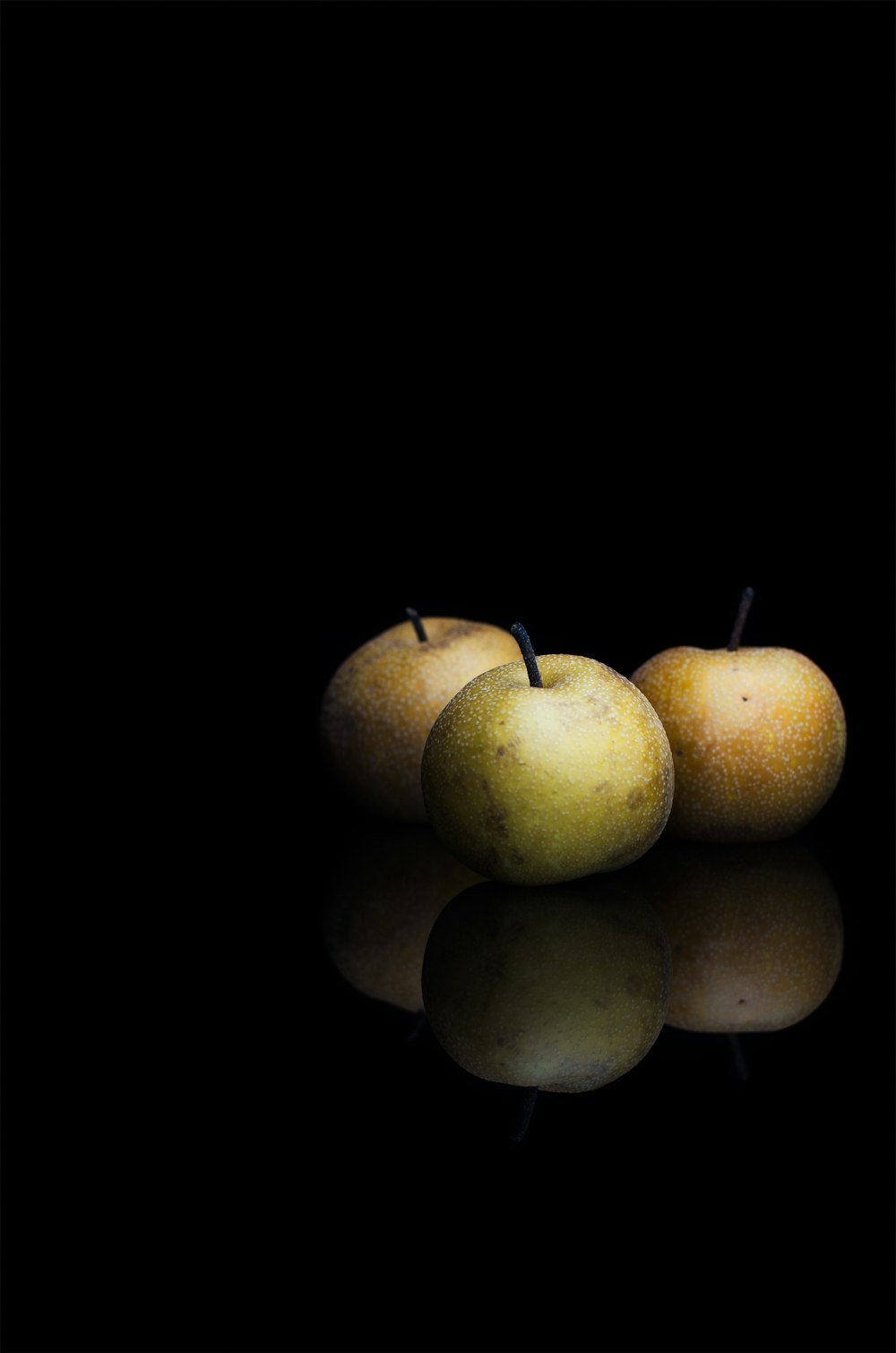 round fruits in dimmed area