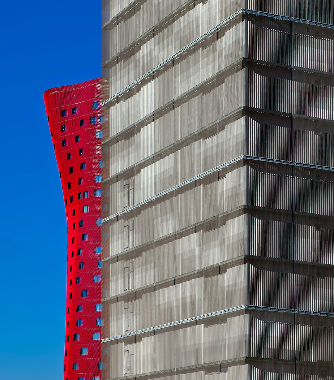 two gray and red buildings