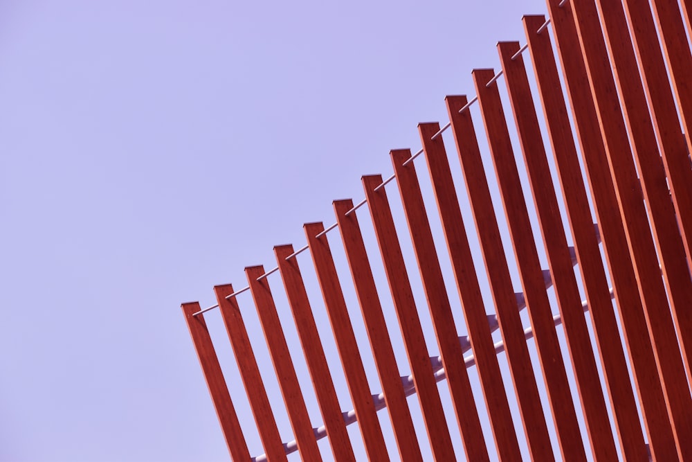 architectural photography of red steel fence