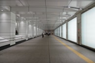 Wide shot of a bright corridor floor painted with slip-resistant coating.