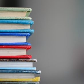 shallow focus photography of books stack of books 