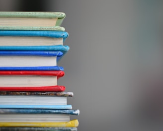 shallow focus photography of books