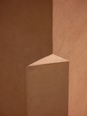 Close-up of a minimalist architectural detail with sharp lines and shadows.