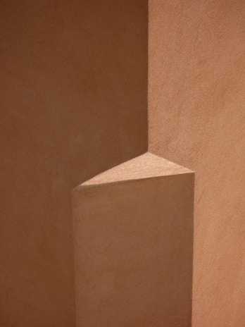 Close-up of a modern architectural detail in muted tones highlighting texture and form.