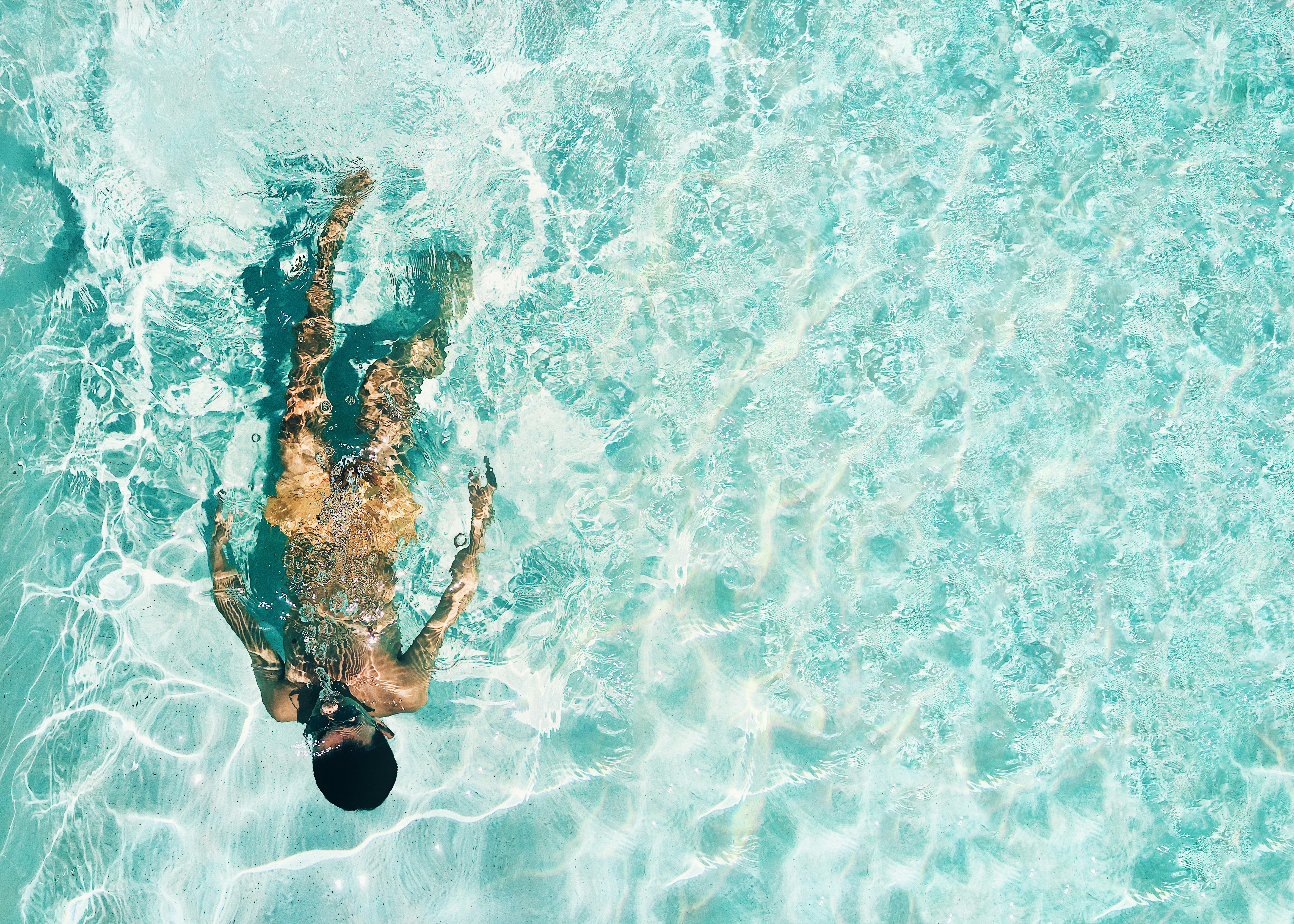 man snorkeling under water