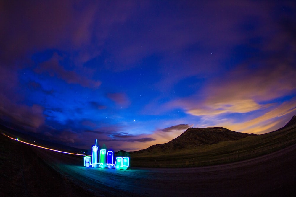 blue and green building on desert