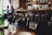 two person sitting on bar stool chair in front of bar front desk