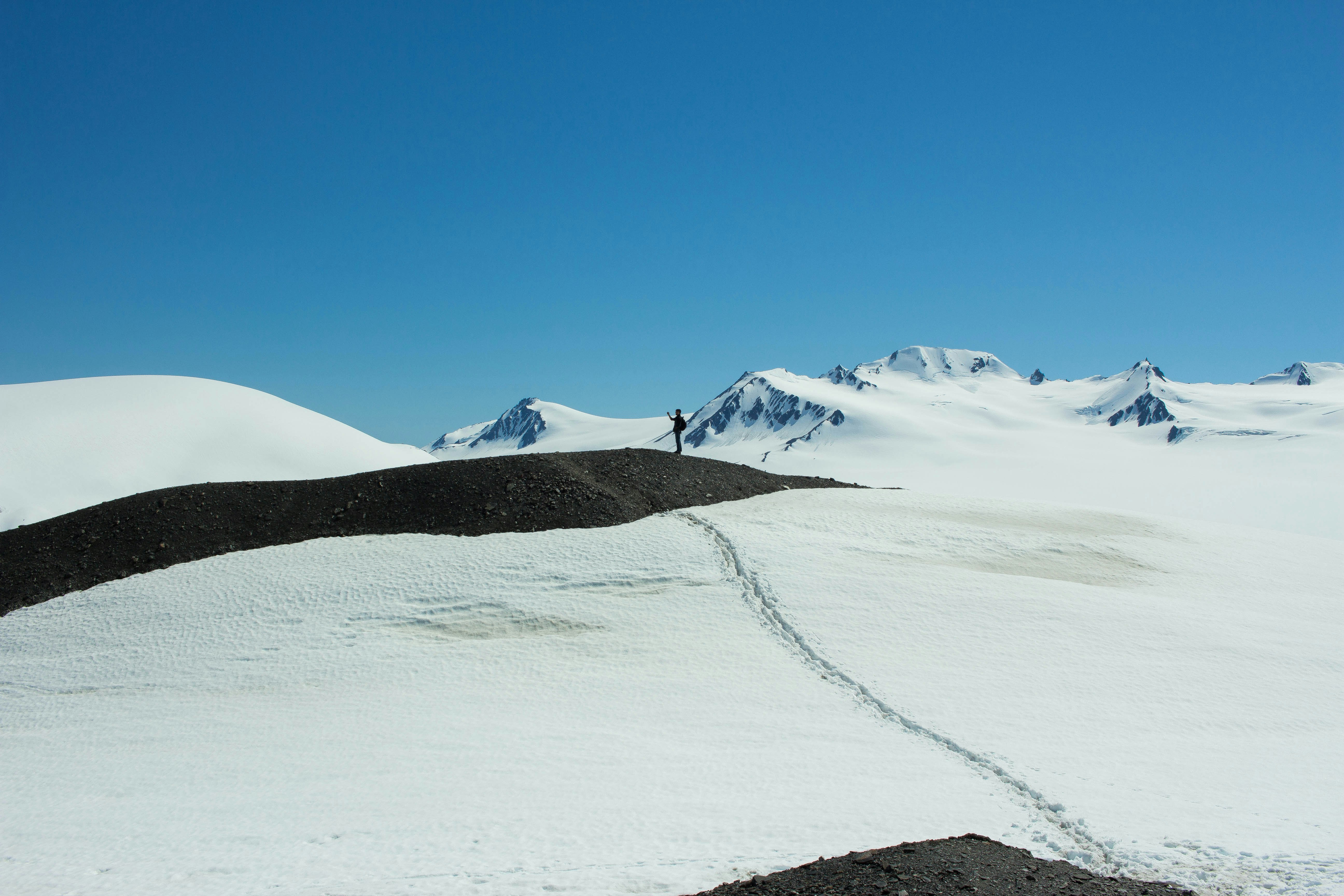 snow covered mountain under blue sky during daytime