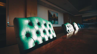 Conference room table crafted from polished wood with matching chairs.