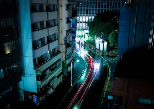 time lapse photography of cars along road