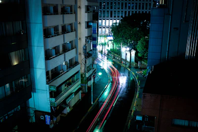 time lapse photography of cars along road