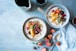 two bowls of oatmeal with fruits