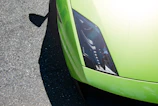 Close-up of the Golfrider's sleek anthracite body with neon green accents under sunlight