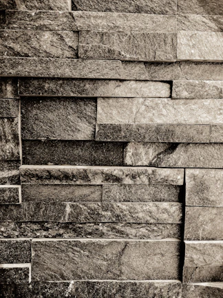 A kitchen backsplash crafted from recycled split stone, blending earthy textures with modern design.