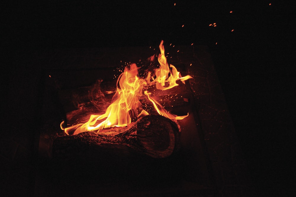 a close up of a fire in the dark