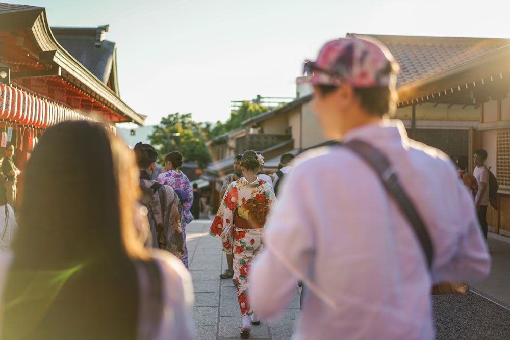 a group of people walking down a street