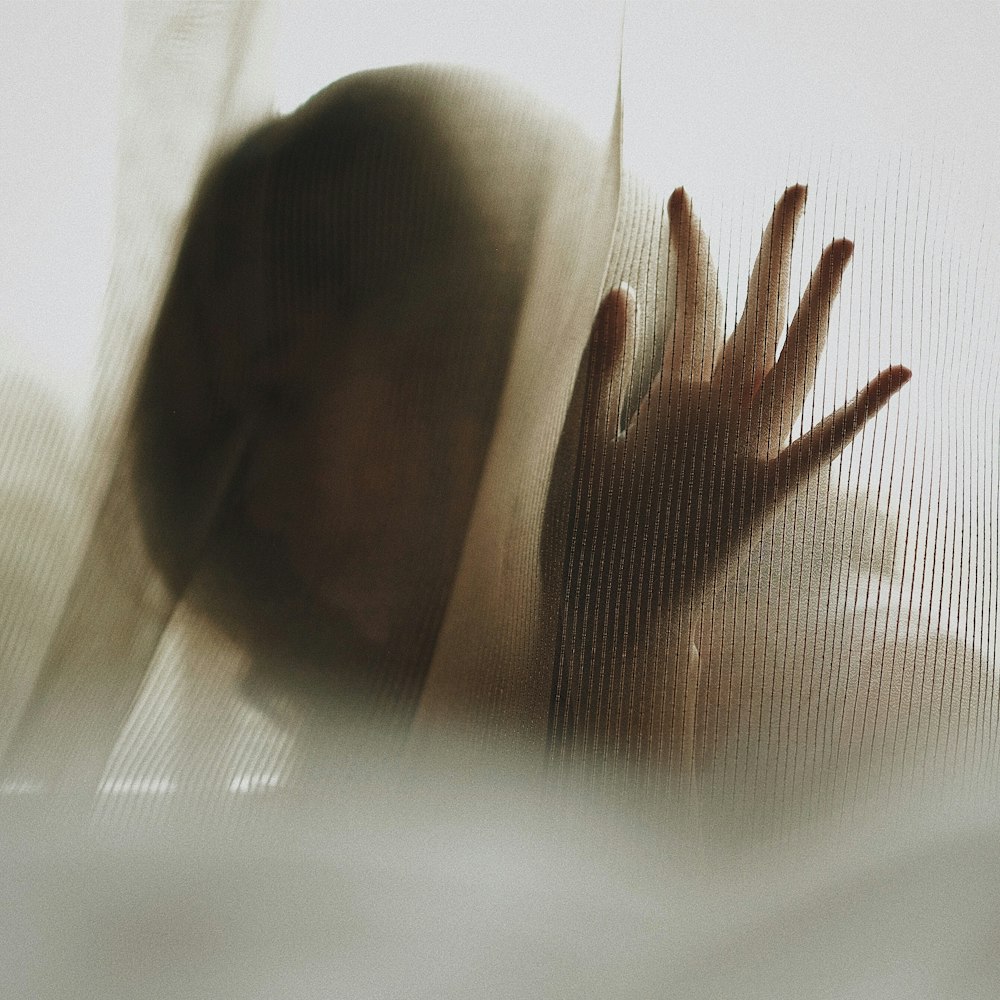 woman touching white textile