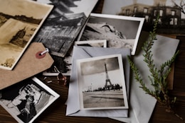 grayscale photo of Eiffel tower on top of white envelope by Joanna Kosinska (https://unsplash.com/@joannakosinska)