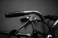 An intimate shot of a rider’s hands gripping the handlebars, showcasing detailed custom grips and controls.