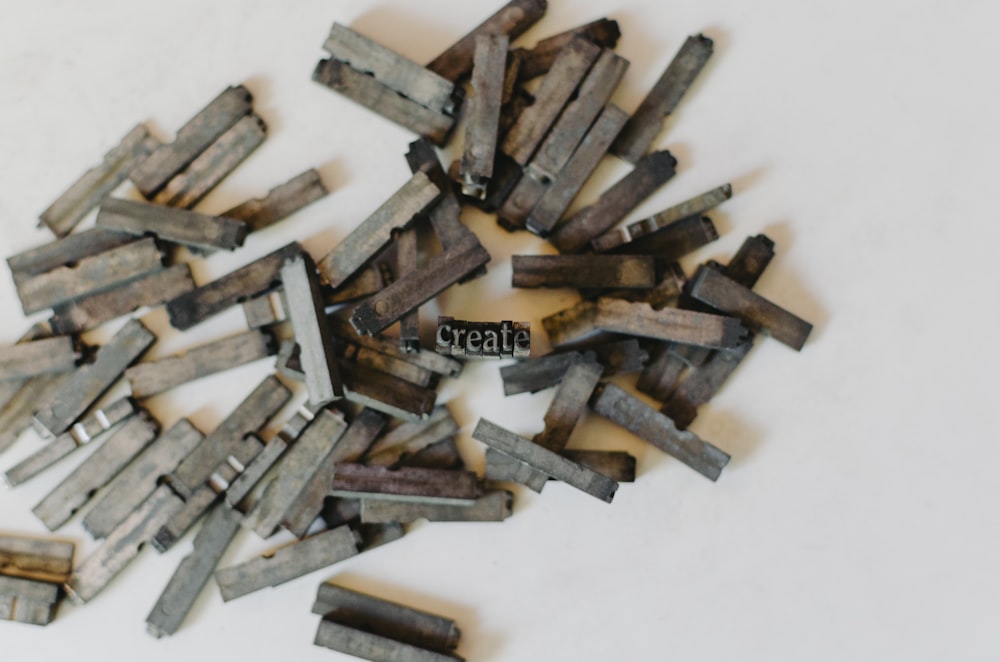 closeup photo of clothespin lot on white surface
