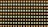 A grid pattern of small LED lights arranged in rows, alternating in color between warmer orange and cooler white tones. The lights are set against a dark background, emphasizing their glow.