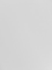 A plain white surface with a smooth texture.
