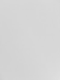 A plain white surface with a smooth texture.