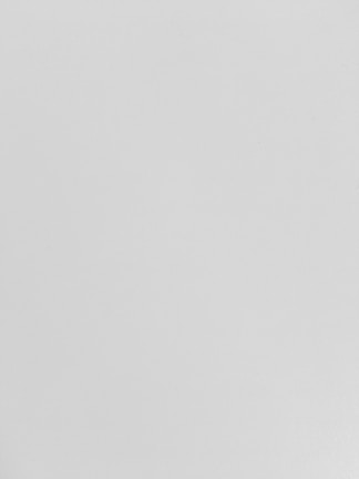 Smooth drywall surface ready for painting in a renovated office space