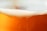 A close-up of a refreshing beer glass filled with golden liquid and foam.