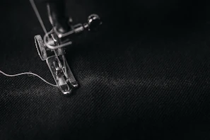 Close-up of the threading machine's precise cutting tool in action