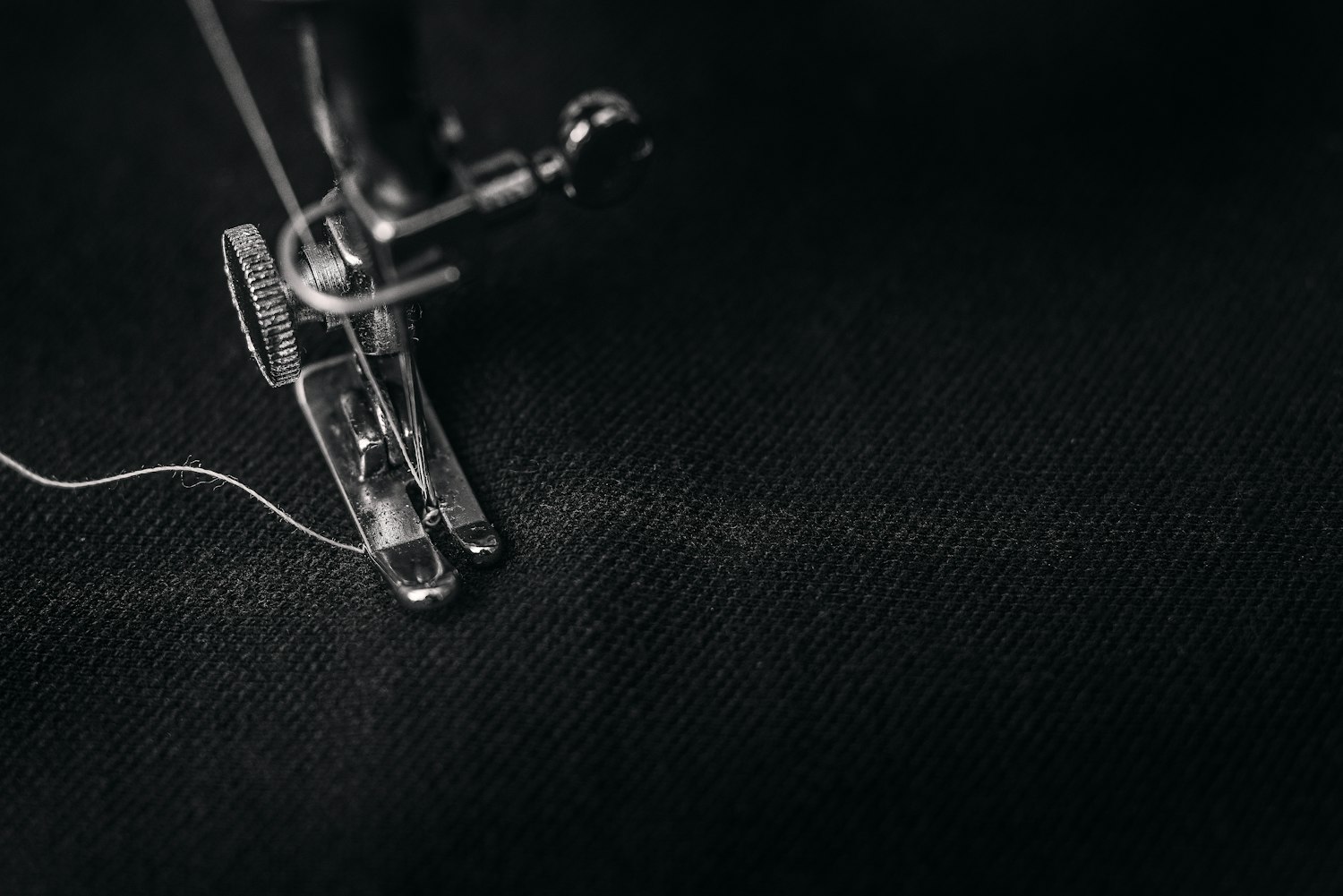 sewing machine on black fabric