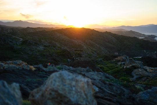 green and gray mountains during sunrise in Cap de Creus Spain